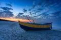Fishing boats on the Baltic Sea beach in Jantar at sunset. Poland Royalty Free Stock Photo