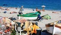 Fishing boats and bathers, Noli, Italian Riviera