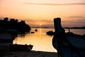 Fishing boats on a beach in front of ruins of a roman fortress at sunset, Sithonia Royalty Free Stock Photo