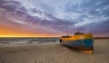 Fishing boats on the beach during a storm