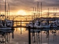 Fishing boats at dock at sunset Royalty Free Stock Photo