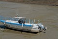 Fishing boats docked in mudflats Royalty Free Stock Photo