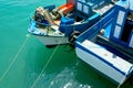 Fishing boats anchored over a clean turquoise water surface Royalty Free Stock Photo