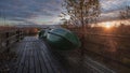 Fishing boats are drying on a wooden pier in the Cancer Lakes nature reserve in the Leningrad region of Russia Royalty Free Stock Photo