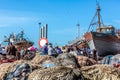 Fishing Boats and fishermen in dry dock at the harbor in Essaouira, Morocco Royalty Free Stock Photo