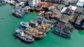 Fishing boats in a fishing village reflecting on the water.