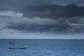 Fishing boats Float on the sea in dark sky and storm coming Royalty Free Stock Photo