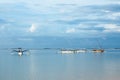 Fishing boats floating on the ocean. Wooden boat sailing in open waters. Sailing boat landscape. Tropical scenery. Bali island, Royalty Free Stock Photo