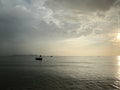 Fishing boats Floating on the sea during the evening time, overcast light To prepare for the sea creatures in the dark Is a backgr