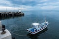 Fishing boats floating in the sea over cloudy sky at Prachuap Khiri Khan, Thailand. Royalty Free Stock Photo