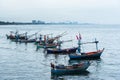 Fishing boats floating in the sea over cloudy sky at Prachuap Khiri Khan, Thailand. Royalty Free Stock Photo