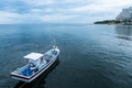 Fishing boats floating in the sea over cloudy sky at Prachuap Khiri Khan, Thailand. Royalty Free Stock Photo