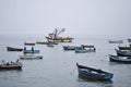 Fishing boats floating on the sea in winter