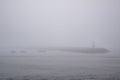 Fishing boats in the fog during toil