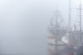 Fishing boats foggy day