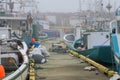 Fishing boats in foggy harbor of Saint Bride`s