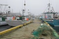 Fishing boats in foggy harbor of Saint Bride`s