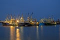 Fishing boats in the harbor from Lauwersoog in Netherlands at night Royalty Free Stock Photo