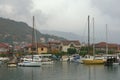 Fishing boats in harbor. Marina Kalimanj in the town of Tivat on a foggy autumn day. Montenegro