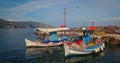 Fishing boats in the harbor of Portes village on the Greek island of Aegina, Saronic gulf, Greece