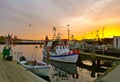 Fishing boats in the harbor at sunset in winter.TravemÃÂ¼nde, Schleswig-Holstein, Germany, Europe Royalty Free Stock Photo