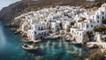 fishing boats in a harbor in a traditional greek island village with old white houses Royalty Free Stock Photo