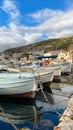 Fishing Boats in a Harbour and a Blue Sky