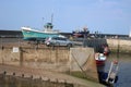 Fishing boats on harbour wall, Seahouses