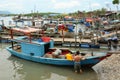 Fishing boats have a rest at the city river port in Vietnam Royalty Free Stock Photo