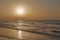 Fishing boats on the horizon returning at sunset