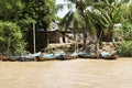 Fishing boats and huts along Mekong River