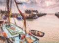 Fishing boats and huts in Whitstable harbour, Kent, UK. Royalty Free Stock Photo