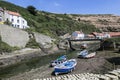 Fishing boats at low tide at Staithes, N. Yorks, England Royalty Free Stock Photo