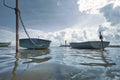 Fishing boats moored. Blue water landscape against a cloudy sky