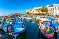 Fishing Boats moored in Kyrenia Girne harbour with restaurants Royalty Free Stock Photo