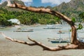 Fishing boats moored in lagoon, sandy beach with rocky island background near El Nido on Palawan island, Philippines Royalty Free Stock Photo