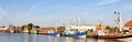 Fishing boats are moored in the fishing port of Busum on the German North Sea coast