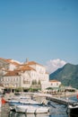 Fishing boats are moored in a row off the coast of Perast. Montenegro Royalty Free Stock Photo