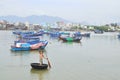 Fishing boats are mooring in a pier in the Cai river of Nha Trang city Royalty Free Stock Photo