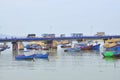 Fishing boats are mooring in a pier in the Cai river of Nha Trang city Royalty Free Stock Photo