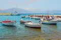 Seascape with sail boats. Mountain range with clouds on background. Pastel colors. Fish industry. Fishing business. Calm