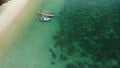 Fishing boats near reef. Beautiful aerial view of fishing boats floating on blue sea water near majestic coral reef. Natural