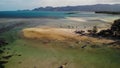 Fishing boats near shore. Various colorful fishing boats floating near coast on sea water in tropical country. Drone top view Royalty Free Stock Photo