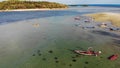 Fishing boats near shore. Various colorful fishing boats floating near coast on sea water in tropical country. Drone top view Royalty Free Stock Photo