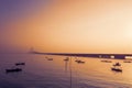 Fishing boats near Suramadu bridge at sunset