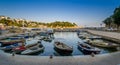 Fishing boats pier at calm summer evening