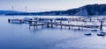 Fishing boats and the pier. Long exposure seascape during sunset, blue hour in the harbour near Byala, Bulgaria.