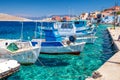 Fishing boats in port in island Halki Chalki in Greece Royalty Free Stock Photo