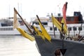 Fishing boats in the port of Nida and flags mark fishing nets Royalty Free Stock Photo