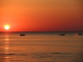 Fishing boats pull their nets at the sunrise. Adriatic cost. Emilia Romagna. Italy Royalty Free Stock Photo